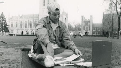Trinity College student with Power Book laptop on Main Quad, 1995.