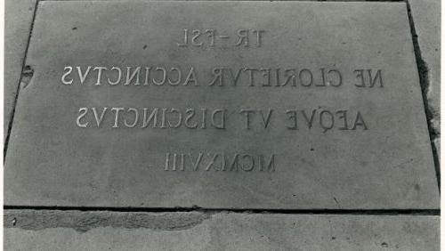 Plaque on Long Walk commemmorating the honorary degree awarded Theodore Roosevelt by Flavel Sweeten Luther. (Photographer unknown, 1919)